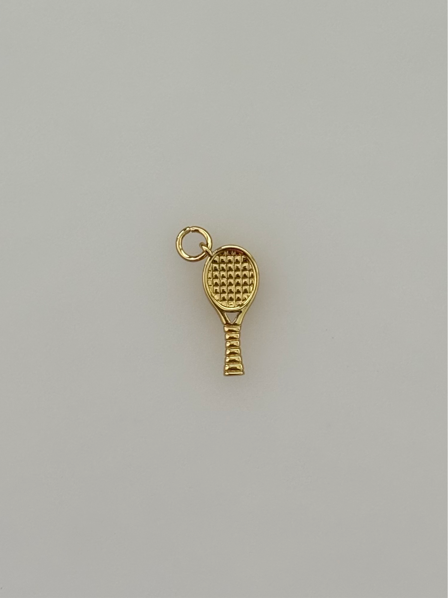 Tennis charm